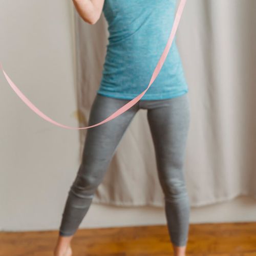 Close up of hands during a rhythmic strength routine.
